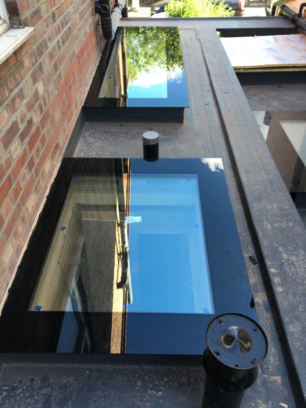 Multiple flat roof skylights on extension in Charlton